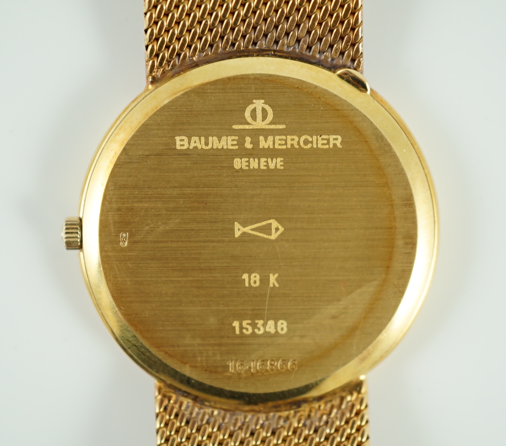 A gentleman's 1980's 18k gold Baume & Mercier quartz dress wrist watch, on a Baume & Mercier 18k gold bracelet